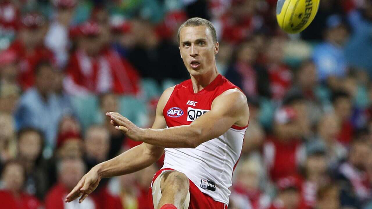 Ted Richards kicks the ball.