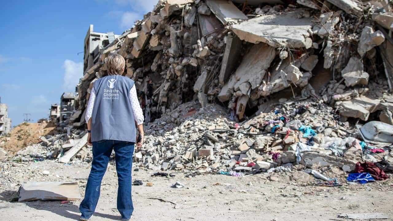 CH11031399_Karyn Beattie, Gaza Team Leader, assesses the destruction in Khan Younis.jpeg