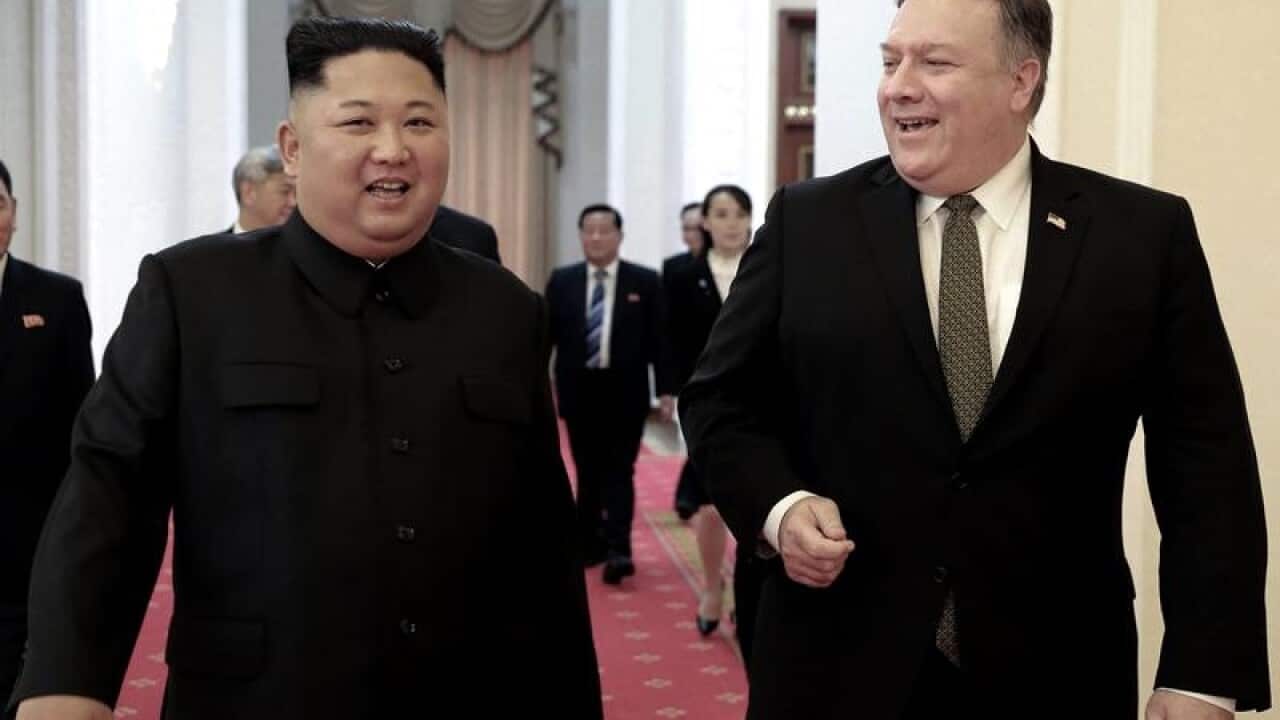 Kim Jong-un and Mike Pompeo