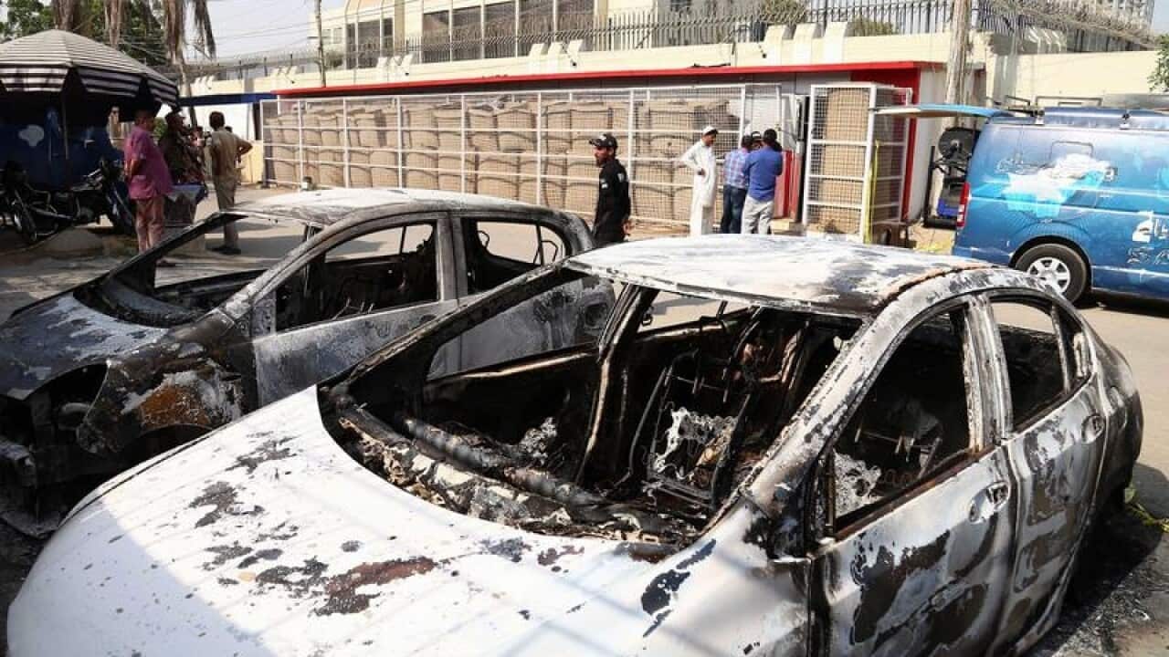Burned vehicles outside the Chinese consulate in Karachi