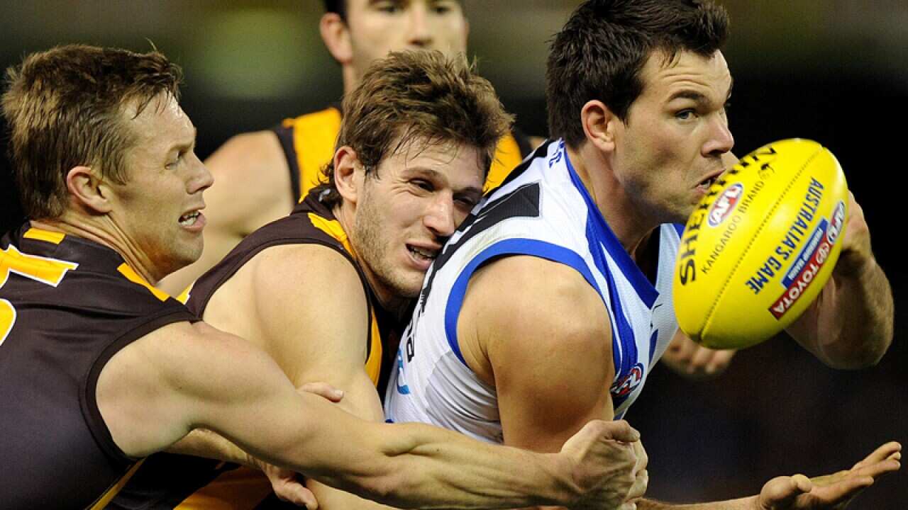 Levi Greenwood of North Melbourne in action against Hawthorn
