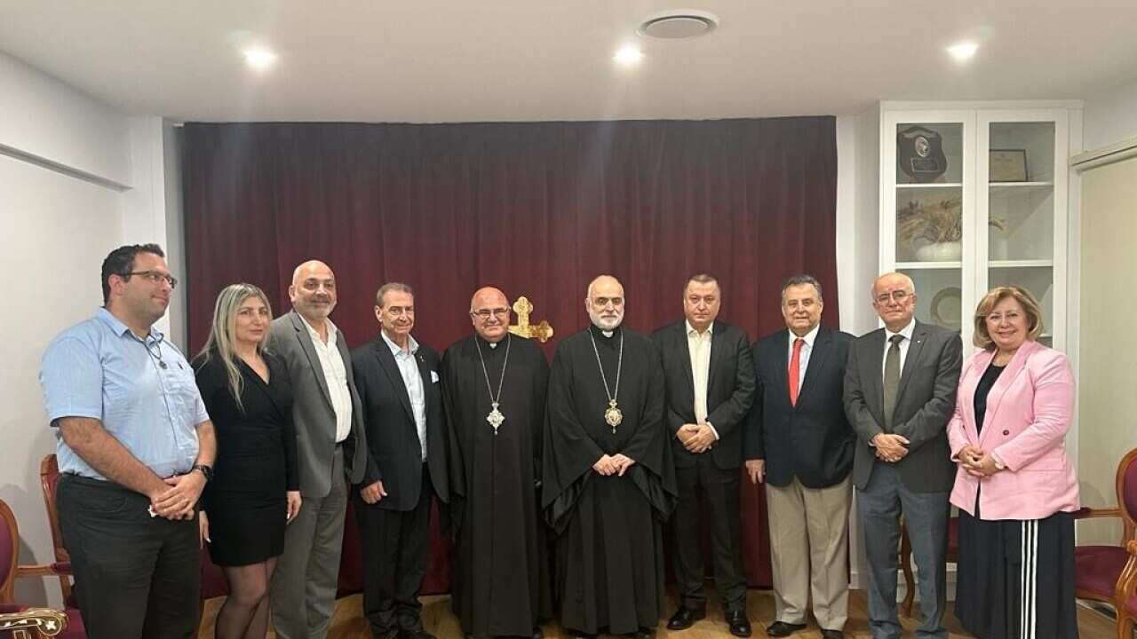 Bishop with Journalists.jpg