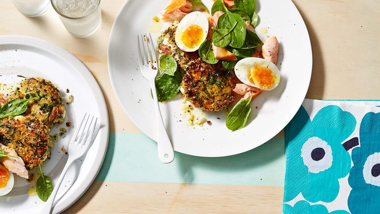 Hot smoked salmon and soft-boiled eggs on quinoa patties