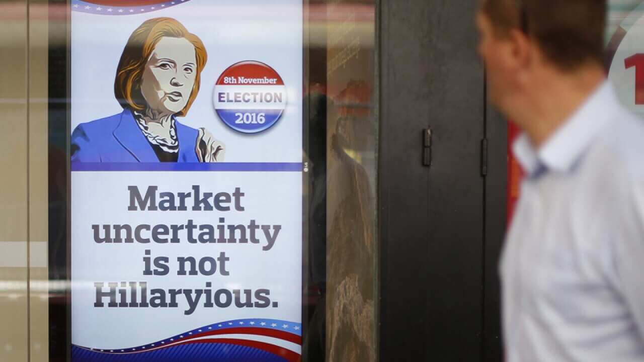 People walk past a currency exchange shop