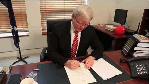 Kevin Rudd dancing at his desk 