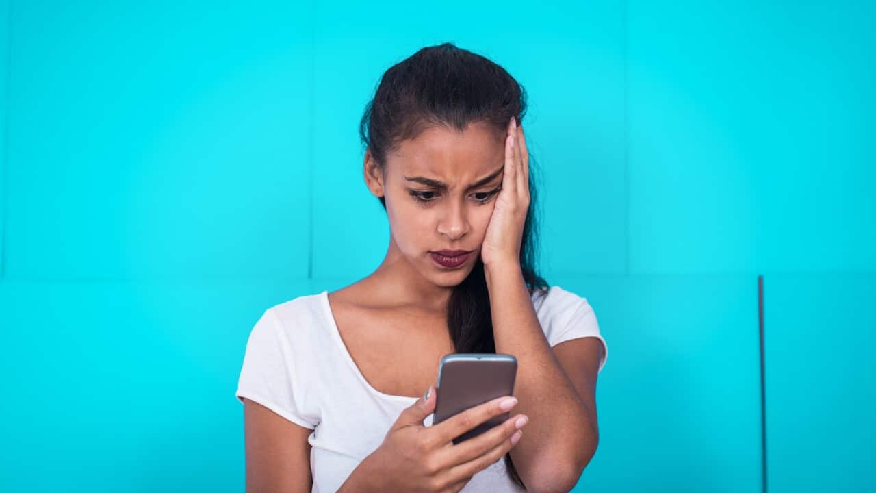 Young woman receive bad text message