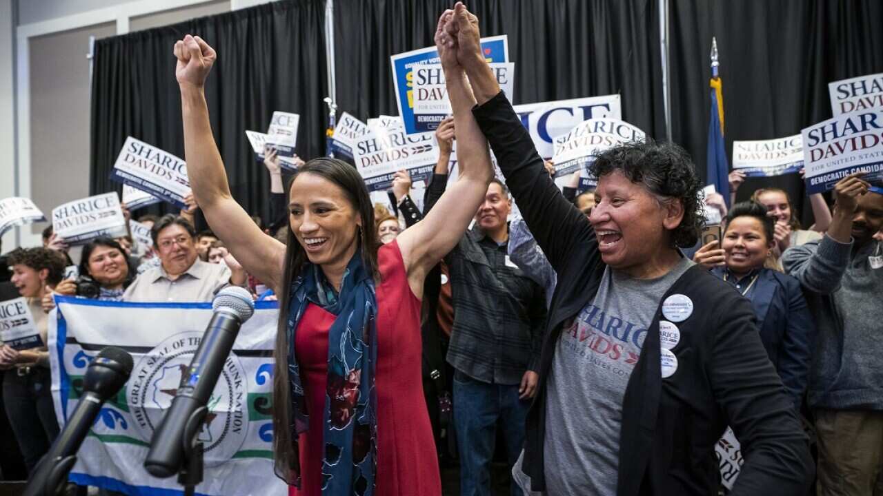 Sharice Davids and her mum Crystal celebrate Davids victory.  