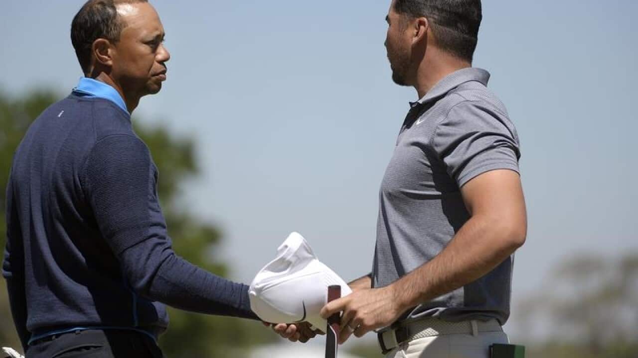 Tiger Woods, left, and Jason Day.