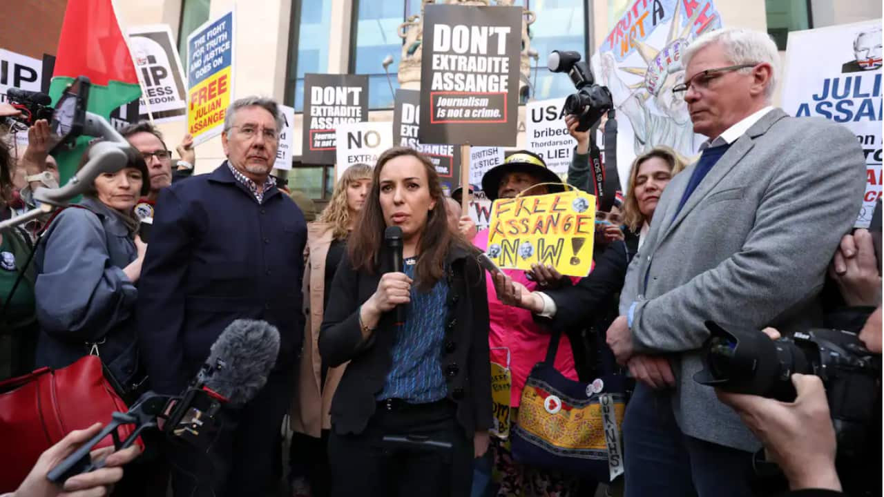 Stella Morris the wife of Julian Assange talks to the media outside Westminster Magistrates' Court in London, after Wikileaks founder Julian Assange was formally issued with an order for extradition to the US