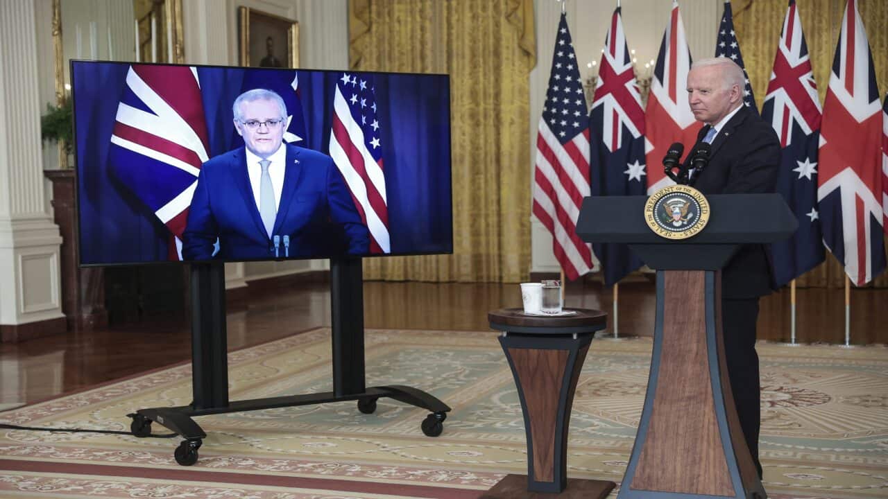 Joe Biden delivers in the White House, joined virtually by Scott Morrison.