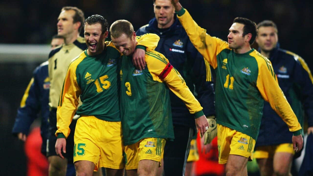 Lucas Neill, Craig Moore, and Stan Lazaridis of Australia celebrate