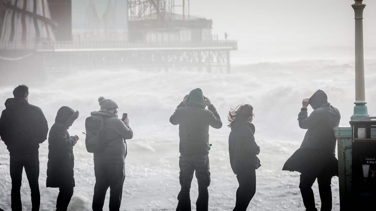 People watch as storm waves break against Brighton Palace Pier on 18 February, 2022 in Brighton, England.