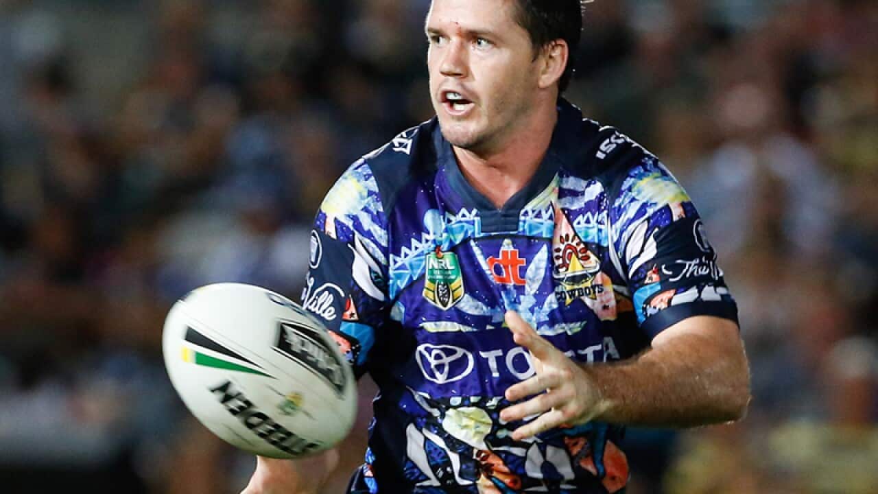 Cowboys' Lachlan Coote passes the ball