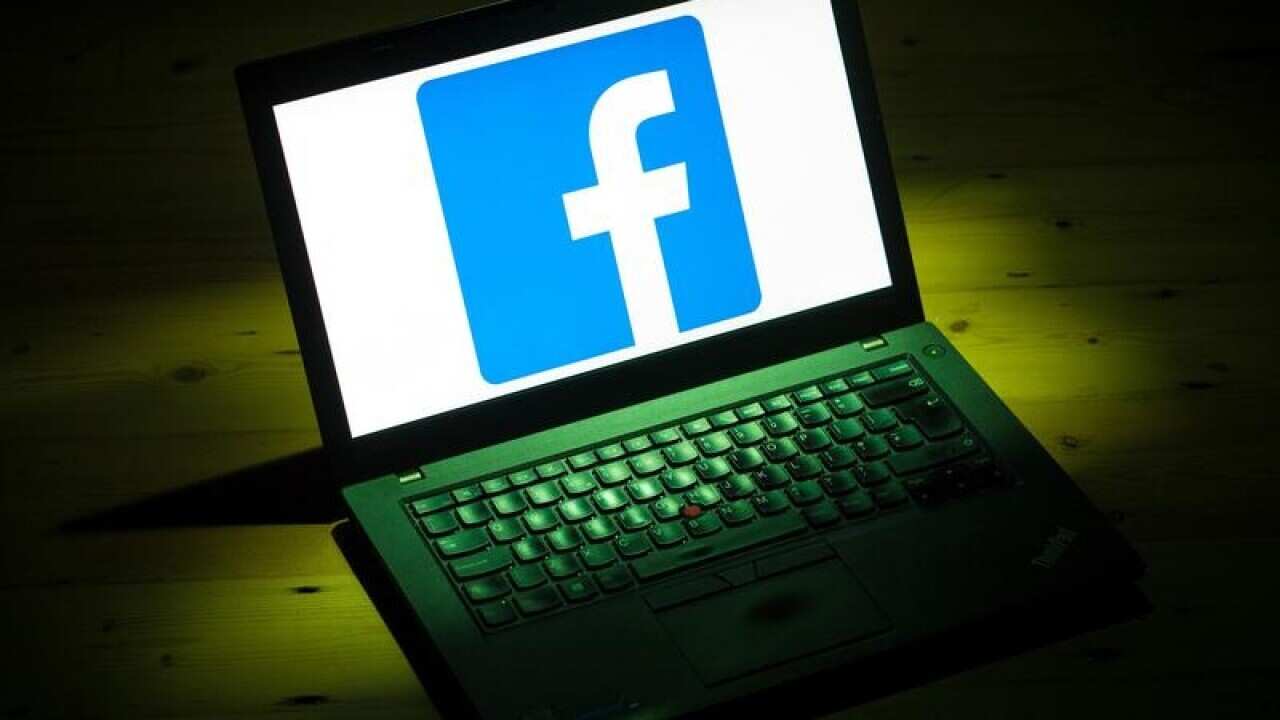 The Facebook logo on a laptop
