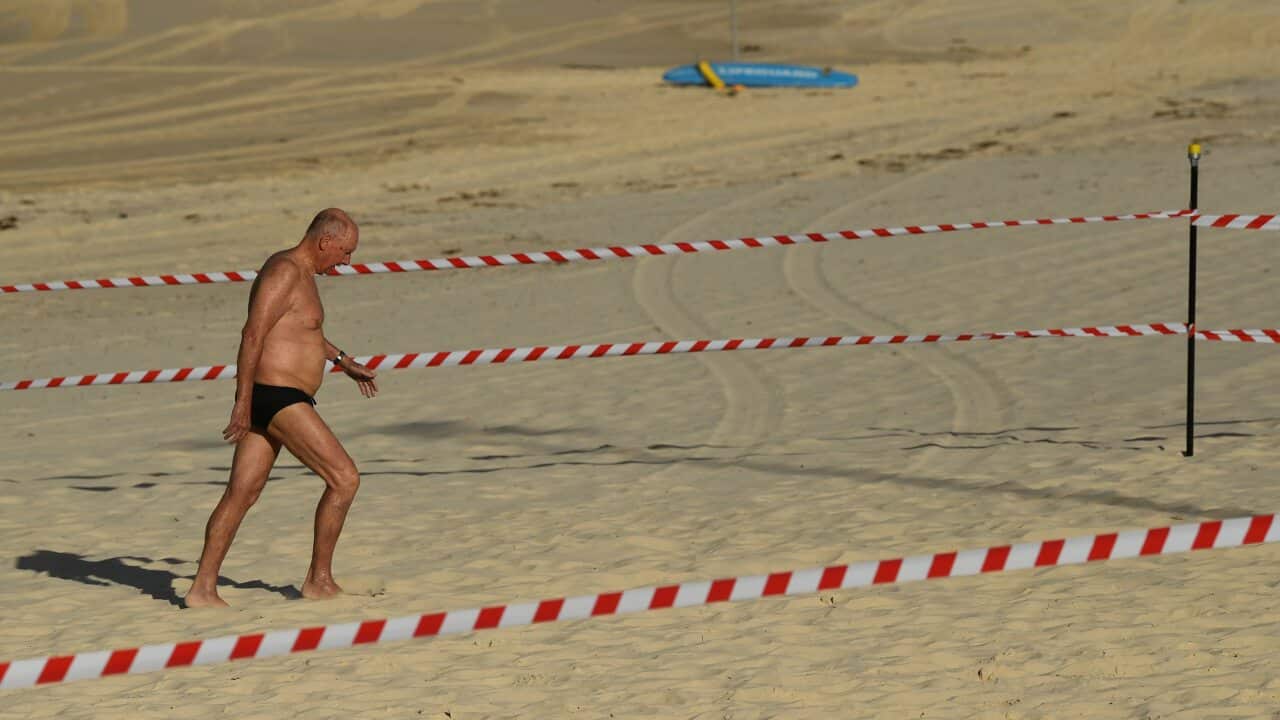 A swimmer leaves the water at Bondi Beach reopens to the public.