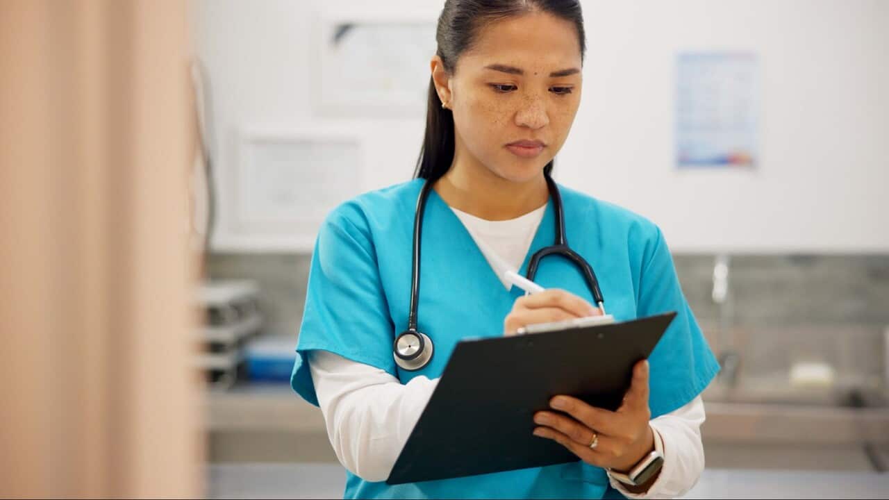 Asian woman, vet and writing with clipboard for results on animal medicine, study or diagnosis at clinic. Young female person or veterinarian taking notes for medical prescription or pet treatment