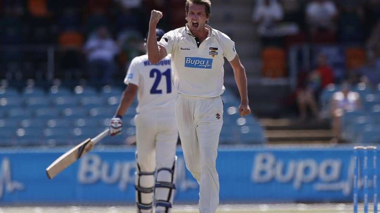 Michael Hogan celebrates