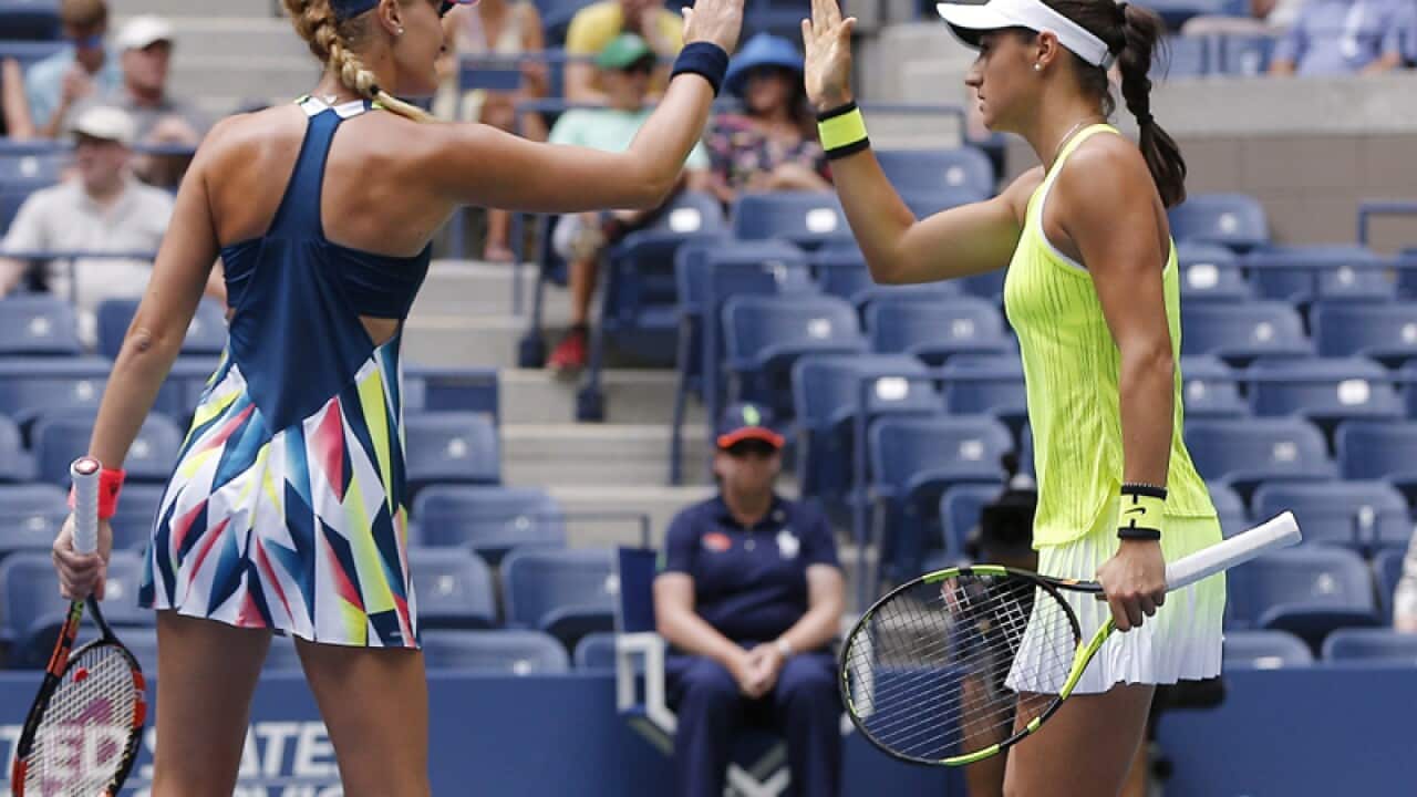 Kristina Mladenovic (L) and Caroline Garcia