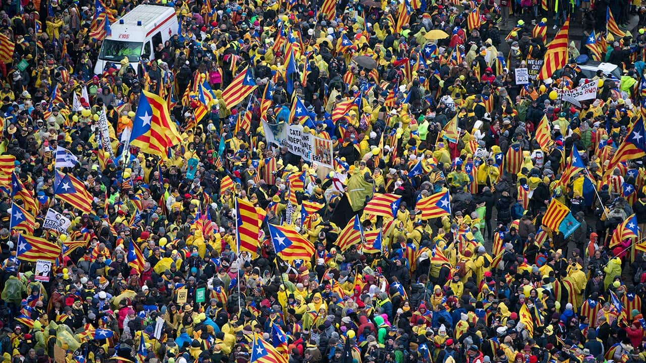 Pro-independence Catalan supporters gather to begin a demonstration near the EU quarter in Brussels.