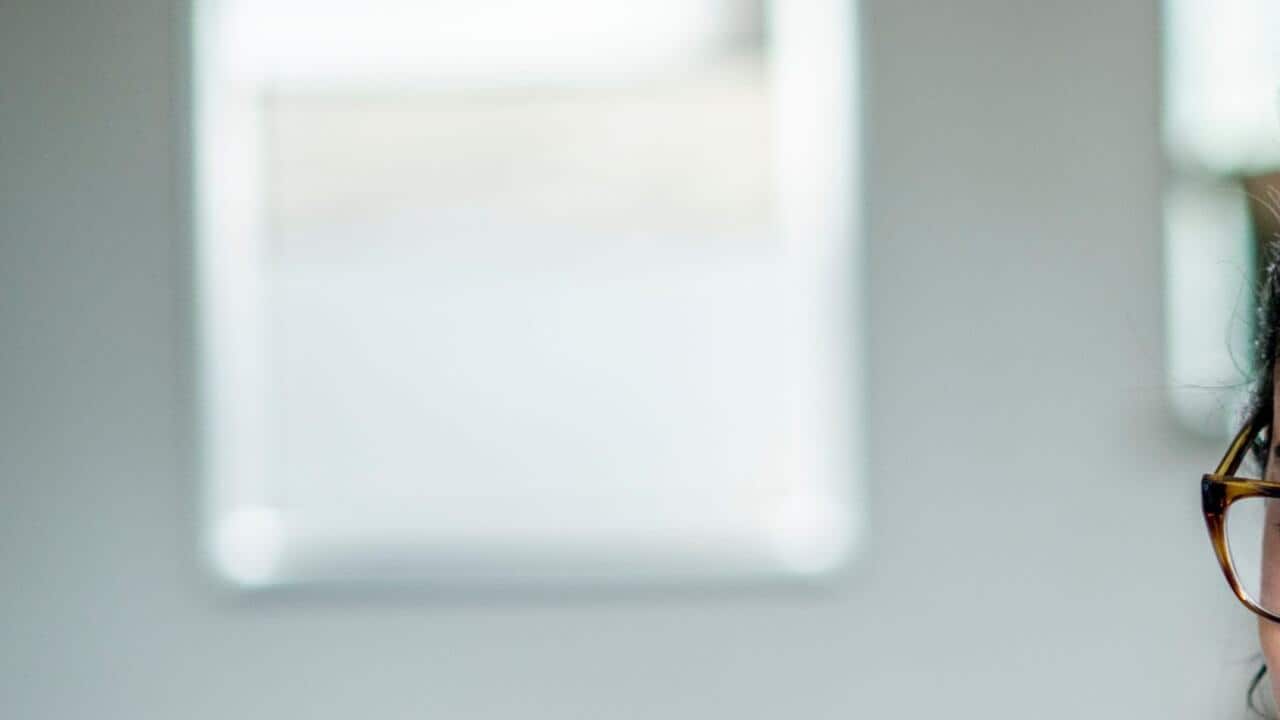 Doctor waiving at a telehealth patient