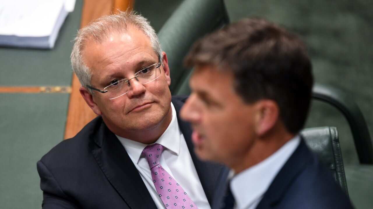Australian Prime Minister Scott Morrison listens to Australian Energy Minister Angus Taylor during House of Representatives Question Time at Parliament House in Canberra, Tuesday, November 26, 2019. (AAP Image/Lukas Coch) NO ARCHIVING