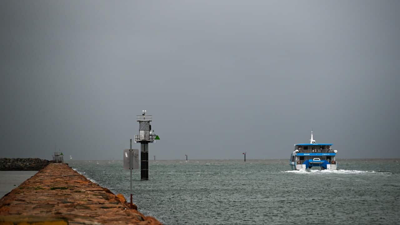 A ferry on the sea near a port