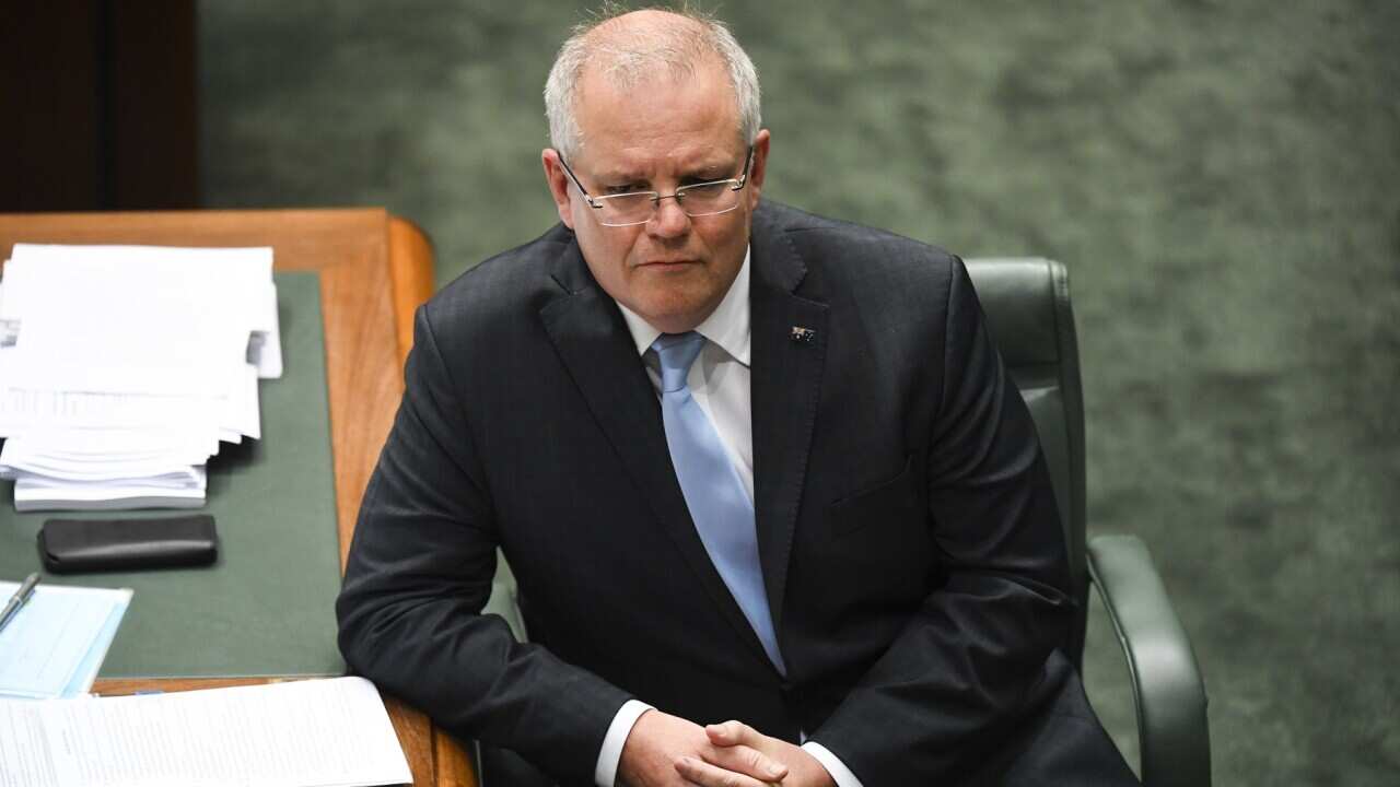 Prime Minister Scott Morrison reacts during the JobKeeper debate