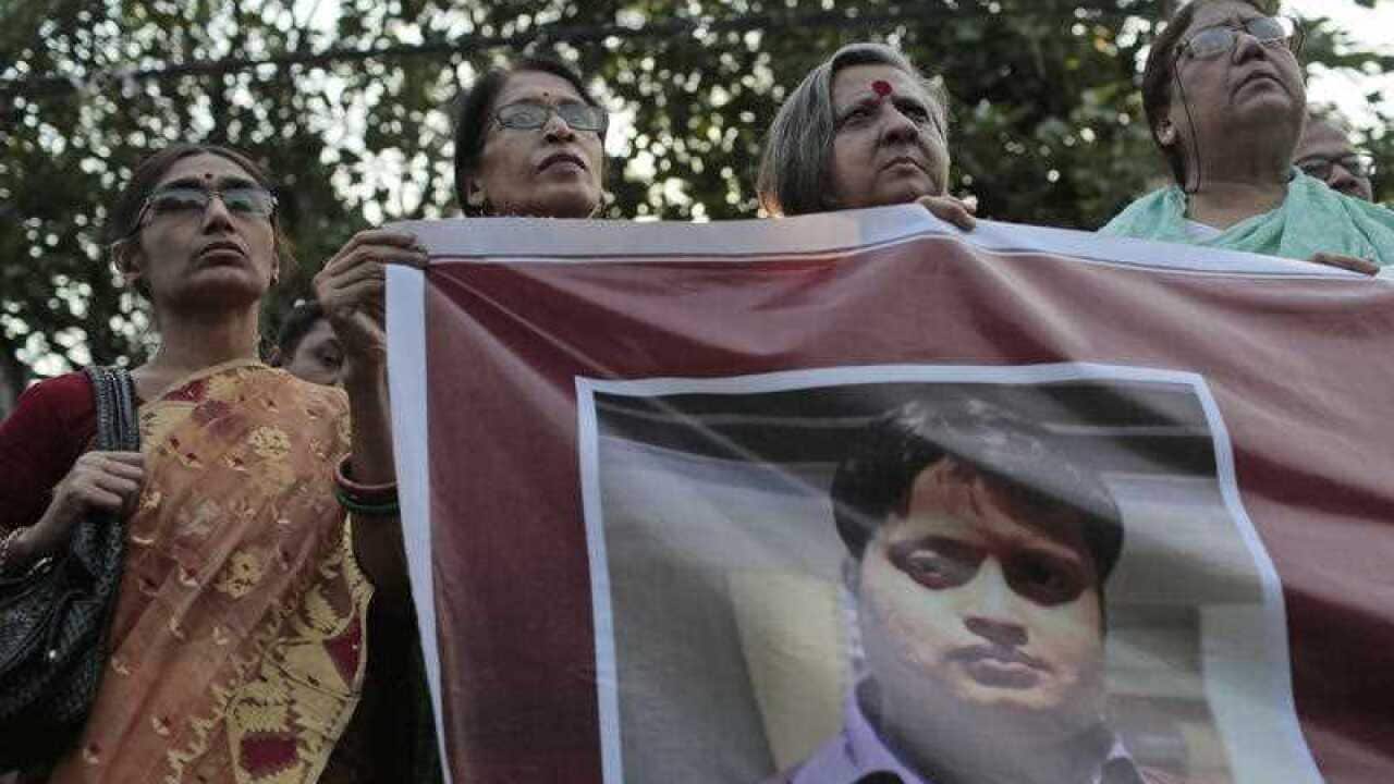 Bangladeshi social activists hold a banner displaying a portrait of blogger and author Ananta Bijoy Das during a protest against his killing, in Dhaka, Bangladesh, Tuesday, May 12, 2015. (AAP)