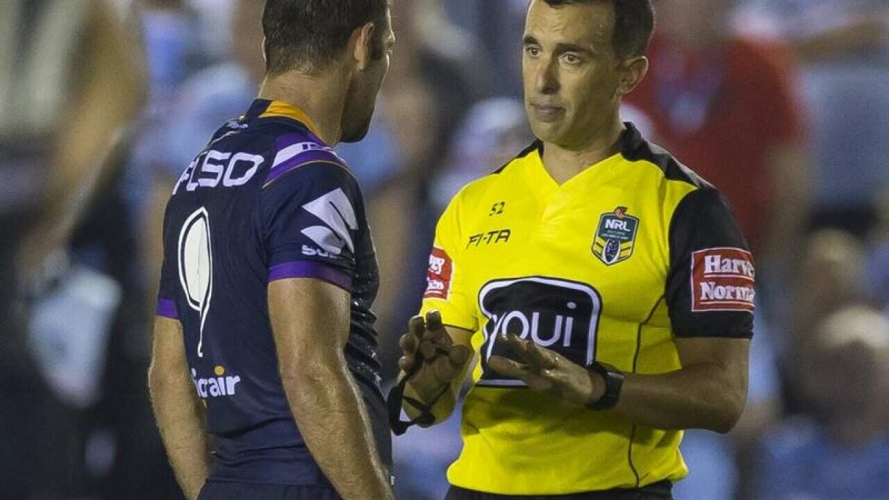 NRL referee Matt Cechhin (R) speaks to Cameron Smith