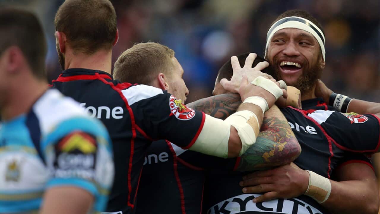 Warriors Manu Vatuvei celebrates with teammates