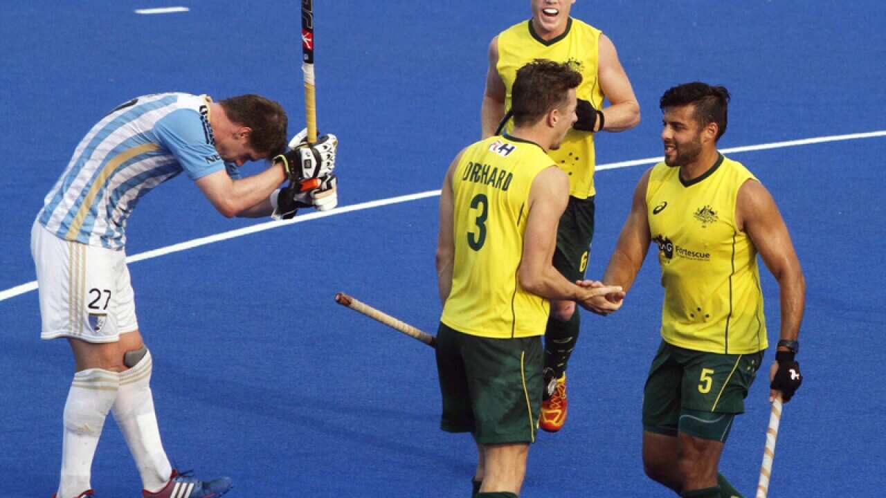 Australian players celebrate a goal against Argentina