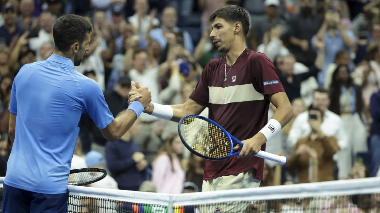 Alexei Popyrin of Australia (R) shakes hands with Novak Djokovic of Serbia after his third round victory during day 5 of the 2024 US Open