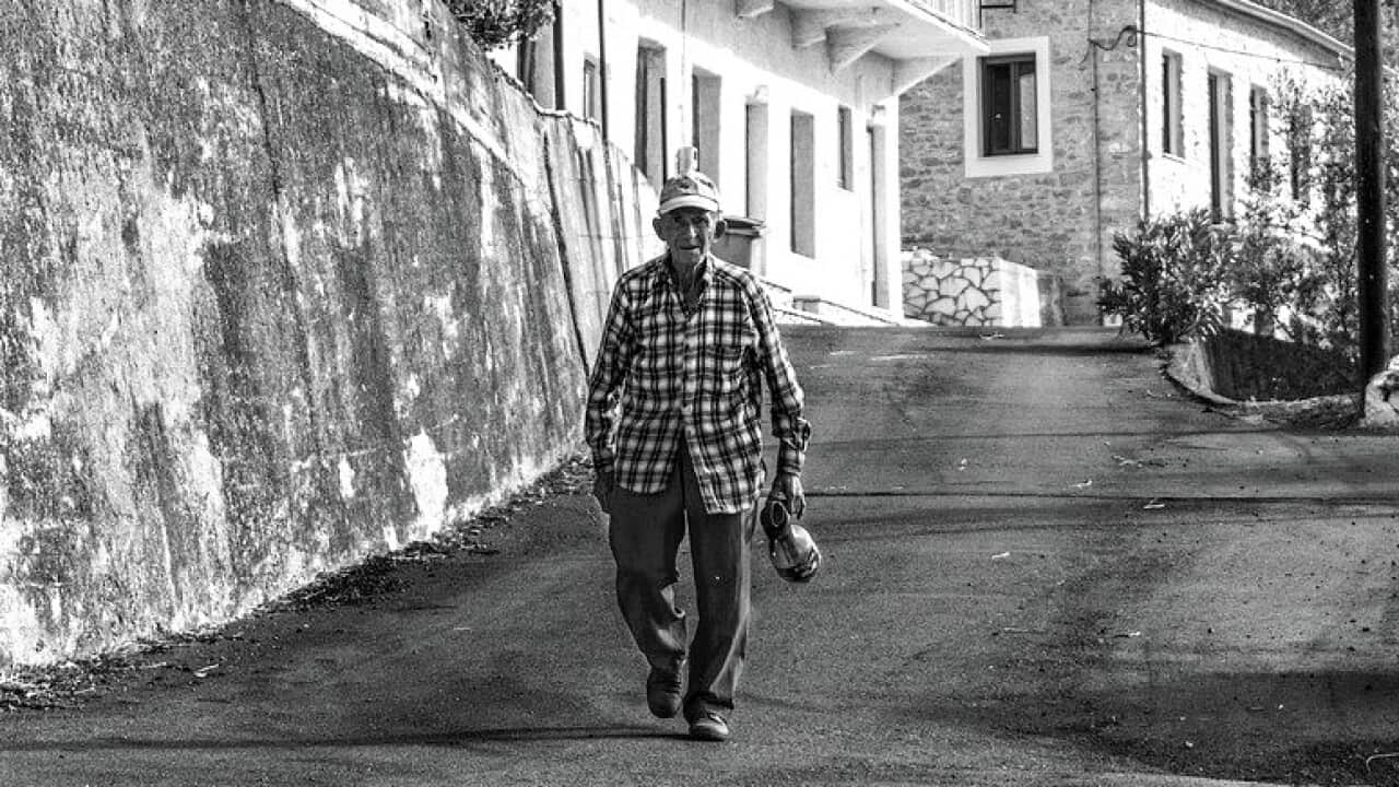 An elderly man in a Greek village.