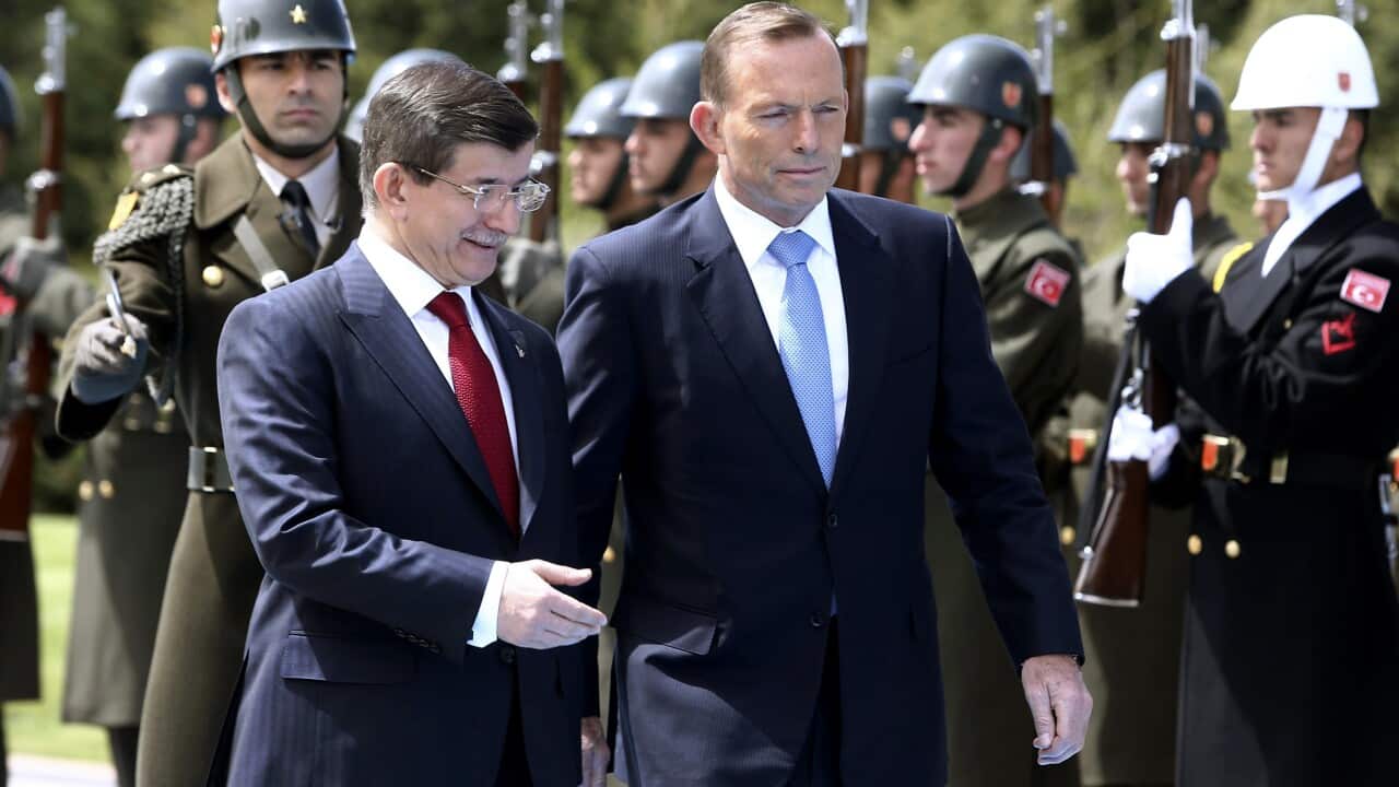 Turkish Prime Minister Ahmet Davutoglu, left, and his Australian counterpart Tony Abbott  (AP Photo)