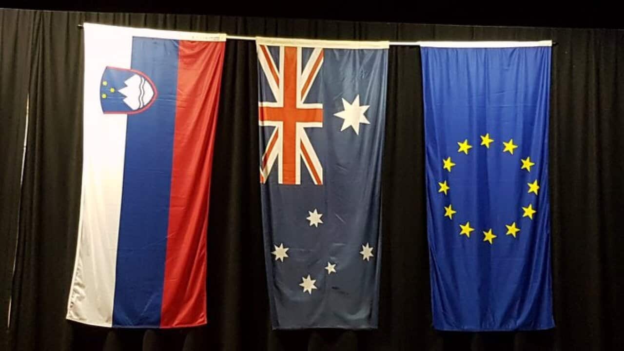 Slovenian, Australian and European Union Flags in the hall of the Slovenian Mission in Kew, Victoria.