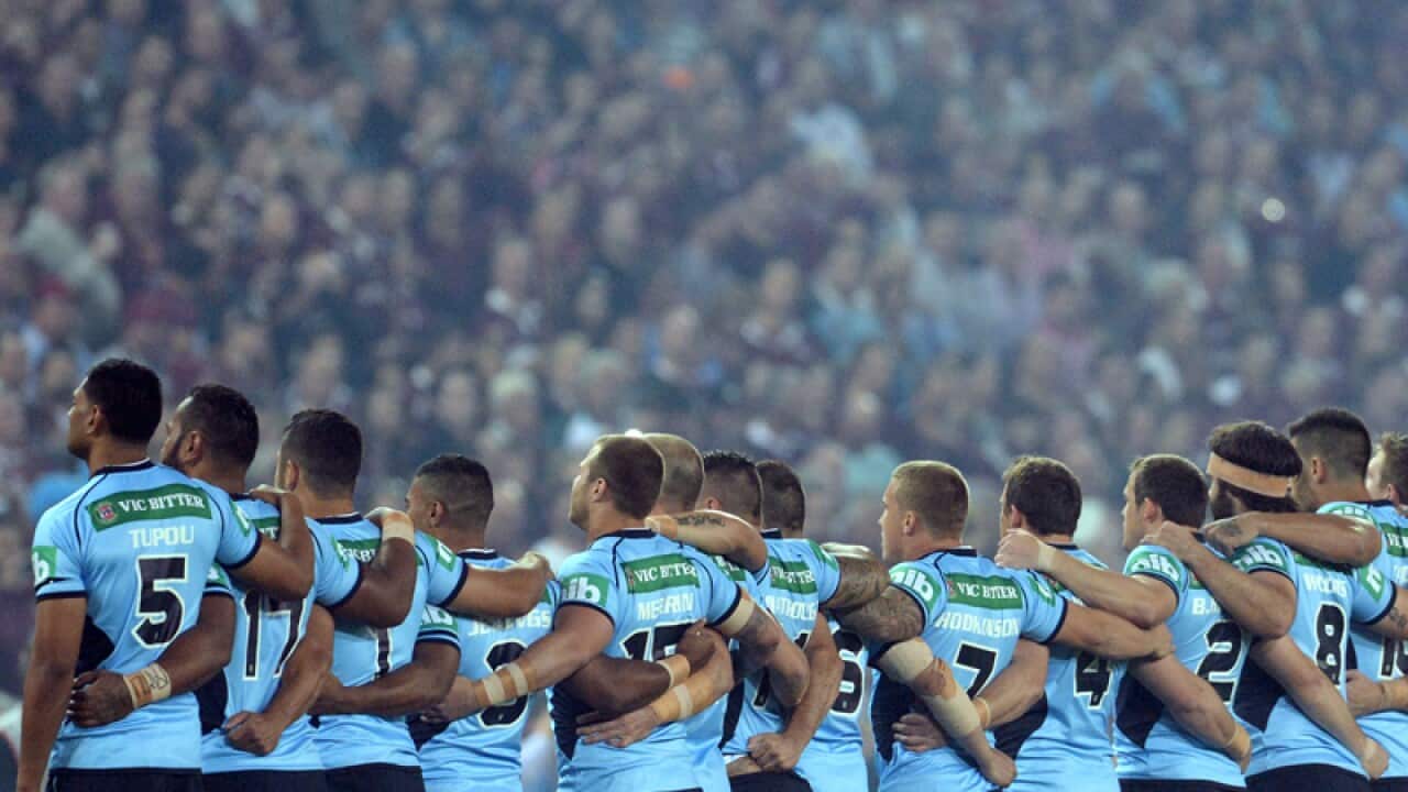 NSW Blues players stand as the national anthem