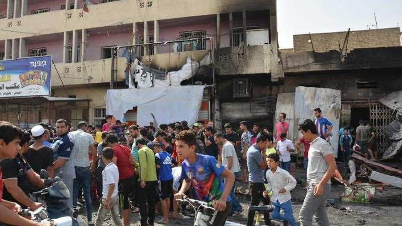 Iraqis following a car bombing in Sadr City Baghdad