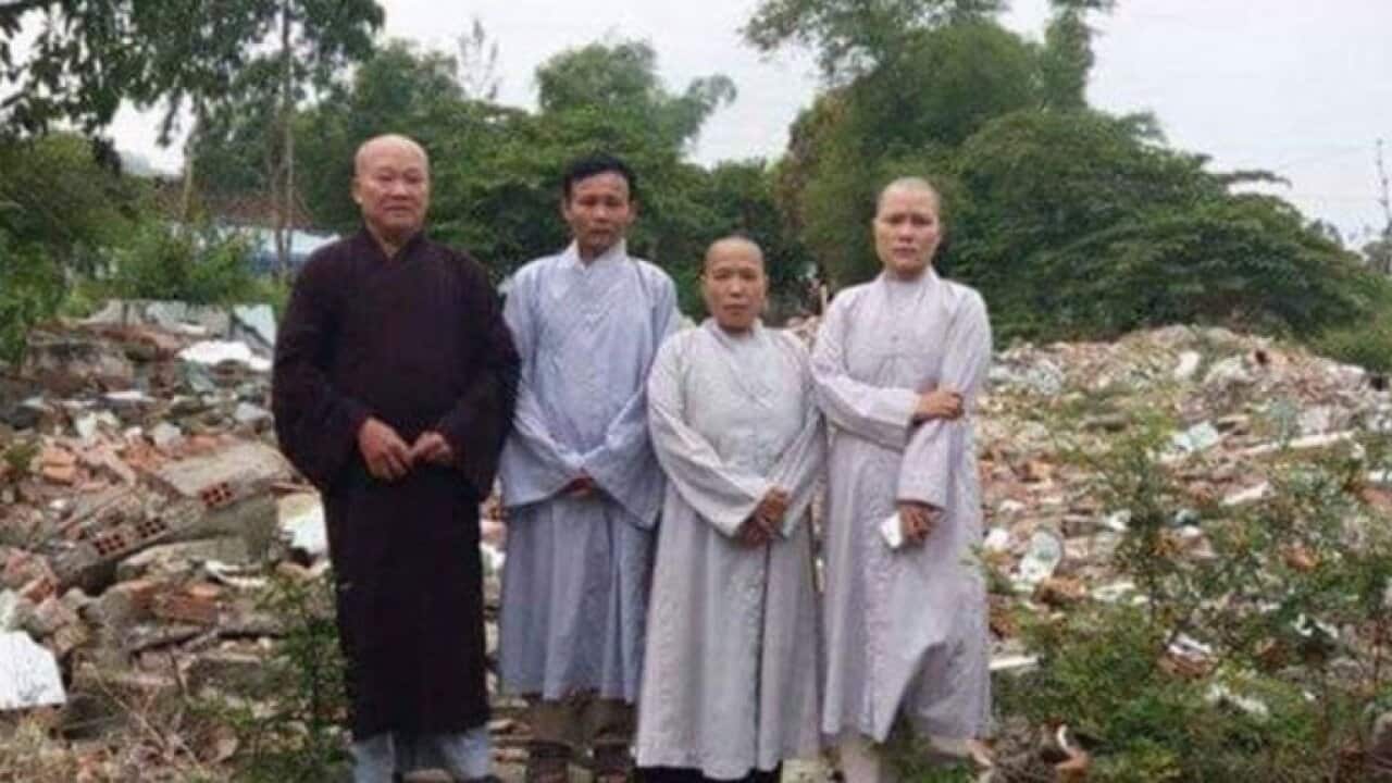 Ven Thich Thien Phuc at the debris of An Cu pagoda, Da Nang