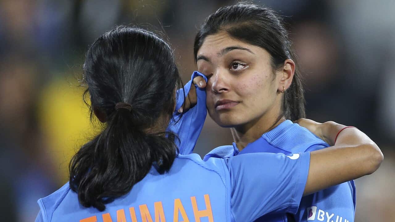 India's Jemimah Rodrigues, left, comforts Smriti Mandhana after their team's loss to Australia in the Women's T20 World Cup cricket final match in Melbourne, Sunday, March 8, 2020. (AP Photo/Asanka Ratnayake)