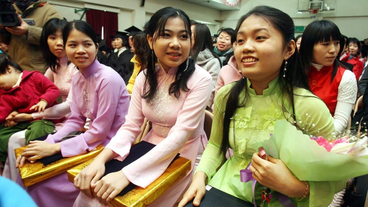 Migrant wives at a graduation ceremony