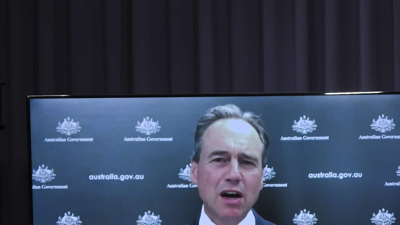 Australian Health Minister Greg Hunt speaks via video link to the media during a press conference at Parliament House in Canberra, Friday, December 24, 2021. (AAP Image/Lukas Coch) NO ARCHIVING