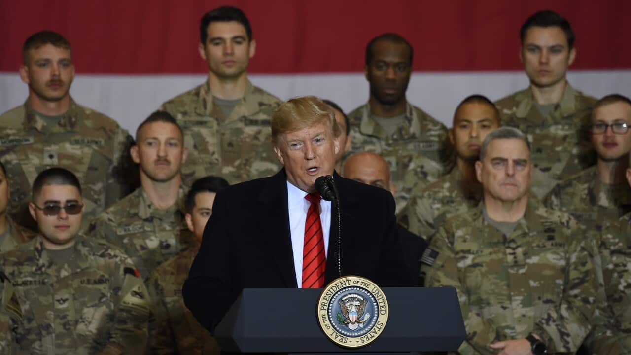 Donald Trump makes surprise Thanksgiving visit to US troops in(02)