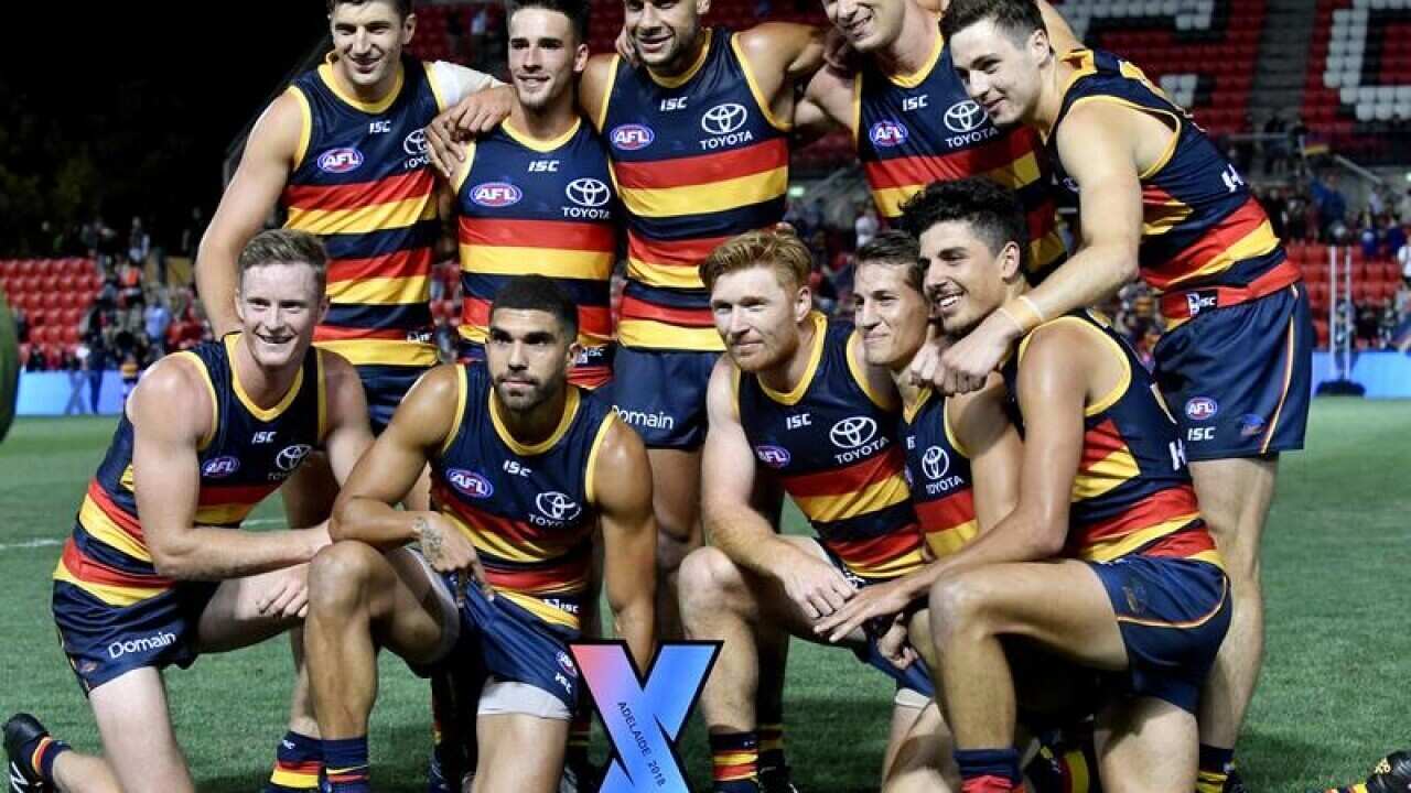The Adelaide Crows pose for photographs