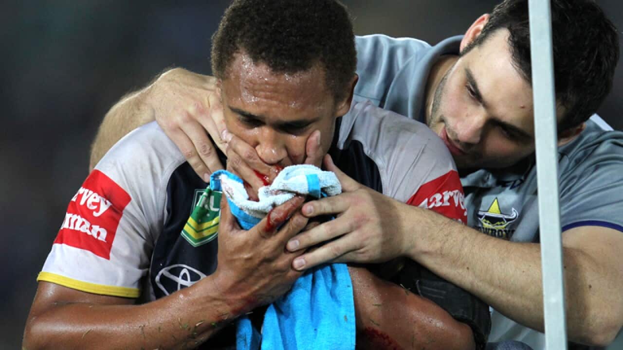 Ray Thompson is treated for a suspected broken jaw