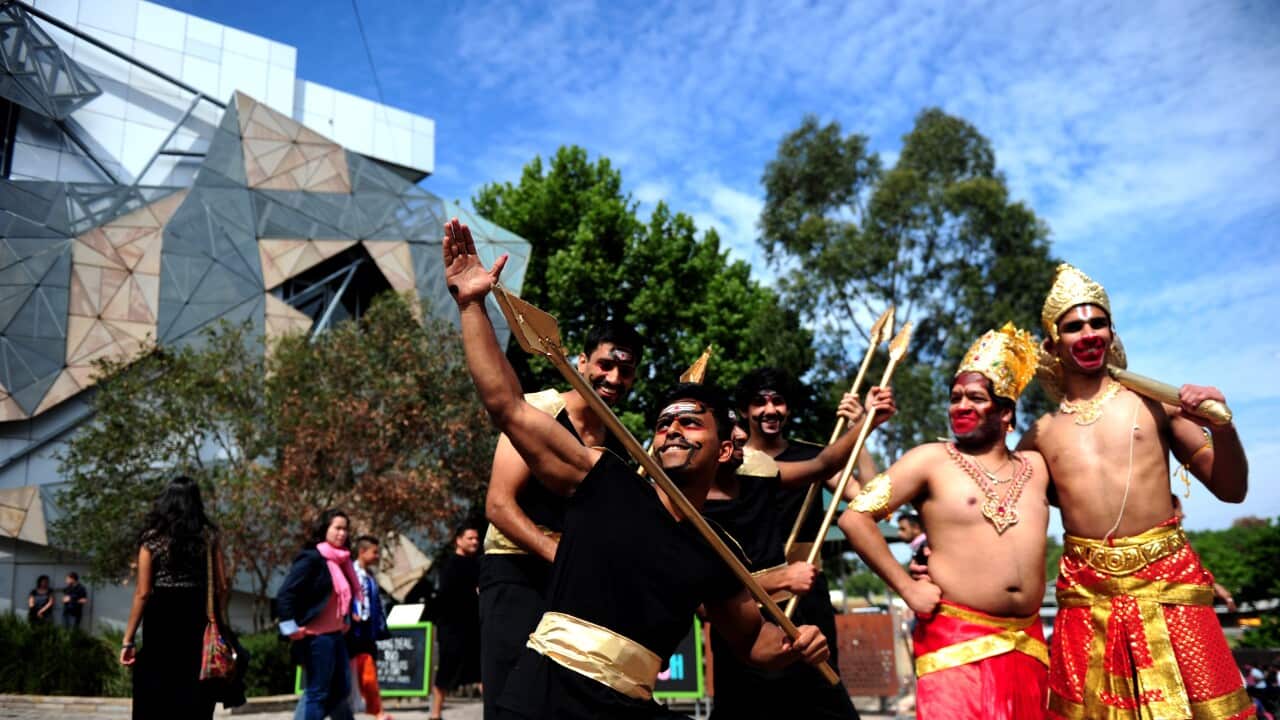 Performers pose for photograhs during Diwali celebrations at Federation Square in Melbourne.