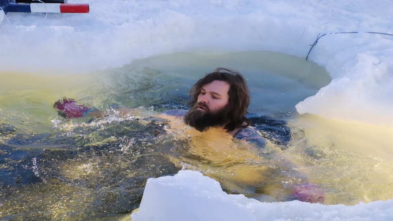 Antarctic expedition members celebrated the midwinter by taking a dip.