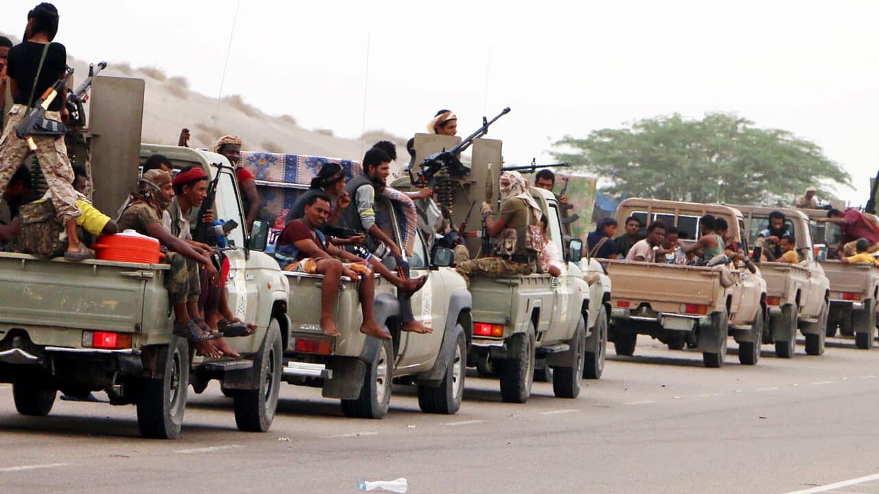 Yemeni forces backed by the Saudi-led coalition take position during an attack on the port city of Hodeidah.