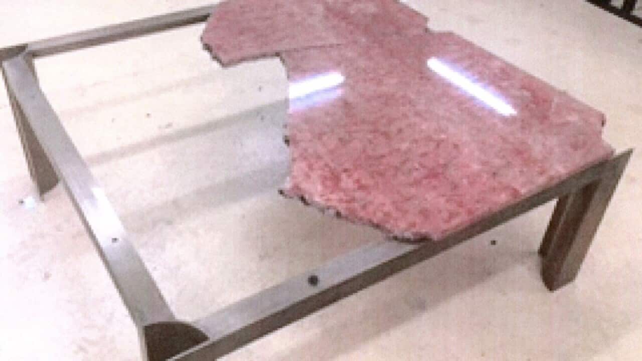 The broken marble table.