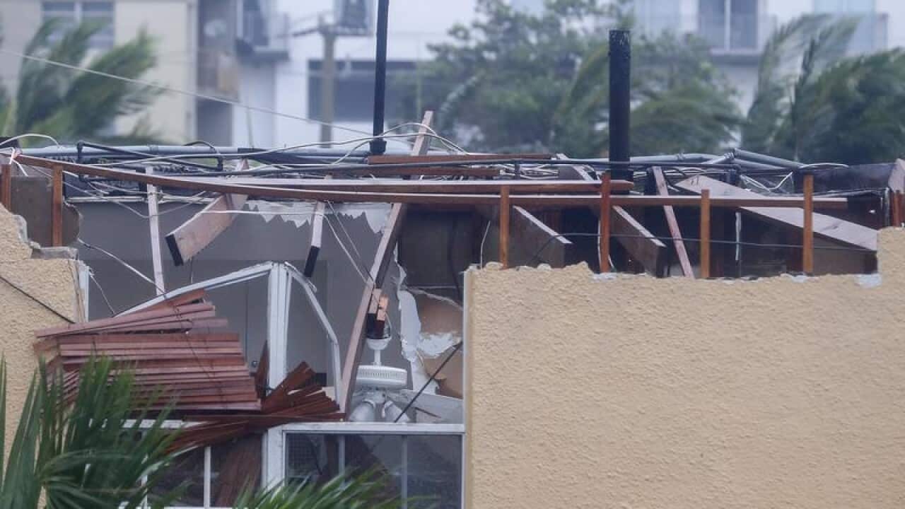 A home with severe roof damage.
