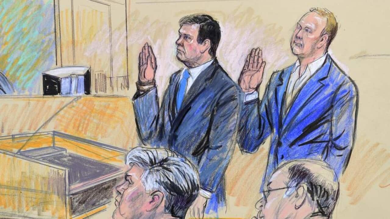 Paul Manafort (C) and Manafort's business associate, Rick Gates